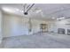 Three car garage with water heater and space for shelving to be used for storage at 45113 W Buckhorn Trl, Maricopa, AZ 85139