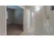 Hallway with access to rooms and a view of the wall decorations and natural light at 45113 W Buckhorn Trl, Maricopa, AZ 85139