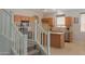 Beautiful kitchen adjacent staircase and stainless steel appliances at 45113 W Buckhorn Trl, Maricopa, AZ 85139
