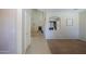 Open-concept living area with fireplace, neutral paint, and plush carpeting for a cozy feel at 45113 W Buckhorn Trl, Maricopa, AZ 85139
