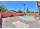 A private pool and backyard surrounded by landscaping at 45113 W Buckhorn Trl, Maricopa, AZ 85139