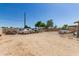 Expansive backyard with plenty of space for parking, features vintage trucks and ample storage at 4712 W Juniper Ave, Glendale, AZ 85306
