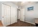 Cozy bedroom showcasing hardwood floors and a large closet for ample storage at 4712 W Juniper Ave, Glendale, AZ 85306