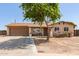 Charming single-story home with a two-car garage, mature landscaping, and a welcoming front yard at 4712 W Juniper Ave, Glendale, AZ 85306