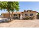 Charming single-story home with a two-car garage, mature landscaping, and a welcoming front yard at 4712 W Juniper Ave, Glendale, AZ 85306