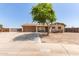 Charming single-story home with a two-car garage, mature landscaping, and a welcoming front yard at 4712 W Juniper Ave, Glendale, AZ 85306