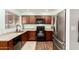 Modern kitchen with stainless steel appliances, granite countertops, and wood cabinets at 4712 W Juniper Ave, Glendale, AZ 85306