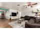 Comfortable living room featuring hardwood floors, stylish furnishings, and modern decor at 4712 W Juniper Ave, Glendale, AZ 85306