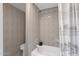 Well-maintained bathroom featuring a tub with shower and decorative tile at 4918 N 74Th St, Scottsdale, AZ 85251