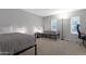 Bedroom with two twin beds, neutral decor, and natural light from two windows at 4918 N 74Th St, Scottsdale, AZ 85251