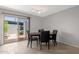 Dining area with a modern table, and chairs with access to a outdoor patio at 4918 N 74Th St, Scottsdale, AZ 85251