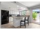 Modern kitchen with stainless steel appliances, stylish backsplash, and an island with seating at 4918 N 74Th St, Scottsdale, AZ 85251