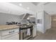 Kitchen view with modern stainless steel oven, granite counter, and stairway access at 4918 N 74Th St, Scottsdale, AZ 85251