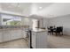 Kitchen view with stainless steel stove, granite counters and attached breakfast bar at 4918 N 74Th St, Scottsdale, AZ 85251