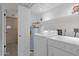 Bright laundry room featuring a modern washer and dryer for efficient home care at 4918 N 74Th St, Scottsdale, AZ 85251