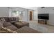 Cozy living room with plush seating, sleek entertainment center, and abundant natural light at 4918 N 74Th St, Scottsdale, AZ 85251
