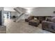 Open living area with a staircase, comfortable seating, dining area and tile flooring at 4918 N 74Th St, Scottsdale, AZ 85251