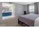 Serene main bedroom with a modern bed frame, gray textiles, and a bathroom suite at 4918 N 74Th St, Scottsdale, AZ 85251