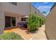 Private patio featuring tile flooring, comfortable seating, and lush landscaping for relaxing outdoors at 4918 N 74Th St, Scottsdale, AZ 85251
