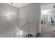 Staircase with modern railing leading to the well lit rooms on the second floor at 4918 N 74Th St, Scottsdale, AZ 85251