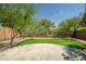 Backyard featuring a large concrete patio and synthetic grass at 5125 E Juana Ct, Cave Creek, AZ 85331