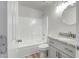 Bathroom featuring shower-tub combo, single sink vanity, and stylish vanity lights at 5125 E Juana Ct, Cave Creek, AZ 85331