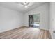 Bright bedroom with wood floors and access to a private outdoor patio at 5125 E Juana Ct, Cave Creek, AZ 85331
