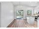 Dining room with access to backyard and a view of the updated kitchen at 5125 E Juana Ct, Cave Creek, AZ 85331