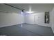 Spacious garage featuring a clean gray epoxy floor and ample room for parking and storage at 5125 E Juana Ct, Cave Creek, AZ 85331