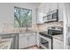 Close-up of the kitchen with stainless steel appliances and granite countertops at 5125 E Juana Ct, Cave Creek, AZ 85331