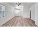 Spacious living room with wood floors, bright windows, and a modern ceiling fan at 5125 E Juana Ct, Cave Creek, AZ 85331
