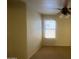 Cozy bedroom with carpet flooring, a ceiling fan, and a window for natural light at 5374 N Ormondo Way, Litchfield Park, AZ 85340