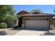 Charming single-story home featuring a well-maintained yard and a spacious two-car garage at 5374 N Ormondo Way, Litchfield Park, AZ 85340