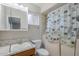 Standard bathroom with a single sink vanity, toilet, tub, and decorative patterned shower curtain at 5618 E Des Moines St, Mesa, AZ 85205