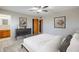 Cozy bedroom with neutral colors, ensuite bathroom, and natural lighting at 5618 E Des Moines St, Mesa, AZ 85205