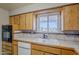 Kitchen with tiled countertops, white appliances, and built-in oven offers functionality at 5618 E Des Moines St, Mesa, AZ 85205