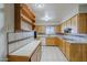 Spacious kitchen with ample cabinet space and tiled countertops at 5618 E Des Moines St, Mesa, AZ 85205