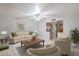 Bright living room featuring neutral tones, a ceiling fan, and an open floor plan at 5618 E Des Moines St, Mesa, AZ 85205