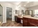 Bathroom with double sink vanity and a walk-in closet at 595 W Dragon Tree Ave, Queen Creek, AZ 85140