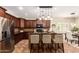 Modern kitchen featuring stainless steel appliances and granite countertops with breakfast bar at 595 W Dragon Tree Ave, Queen Creek, AZ 85140