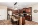 Well-equipped kitchen with modern appliances, granite countertops, and dark wood cabinetry at 595 W Dragon Tree Ave, Queen Creek, AZ 85140