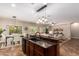 Bright, spacious kitchen with an island bar open to the dining and living areas at 595 W Dragon Tree Ave, Queen Creek, AZ 85140