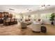 Open concept living area with a seamless flow into kitchen and dining, bright natural light at 595 W Dragon Tree Ave, Queen Creek, AZ 85140