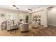 Bright living room with ceiling fans, neutral furniture, and decor at 595 W Dragon Tree Ave, Queen Creek, AZ 85140