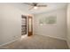 Bedroom features a ceiling fan, closet, and window, creating a comfortable atmosphere at 606 W 15Th St, Tempe, AZ 85281