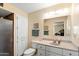 Traditional bathroom with white cabinets, neutral countertops, and shower with a built-in seat at 636 S Rosemont --, Mesa, AZ 85206
