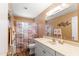 Cozy bathroom featuring an updated vanity, mirror, lighting, and shower-tub combo with stylish curtain at 636 S Rosemont --, Mesa, AZ 85206