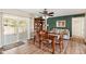 Inviting dining room with wood floors and sliding glass door to outdoor entertaining at 636 S Rosemont --, Mesa, AZ 85206
