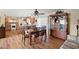 Elegant dining room featuring a wood table and chairs, adjacent to the kitchen and living area at 636 S Rosemont --, Mesa, AZ 85206