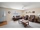 Cozy living room with plush furniture, a ceiling fan, and a warm, inviting atmosphere at 636 S Rosemont --, Mesa, AZ 85206